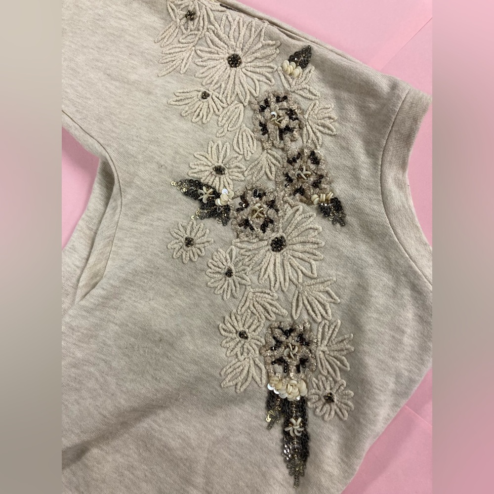 Love Sam appliqué sweatshirt in beige tones with asymmetrical flower design.